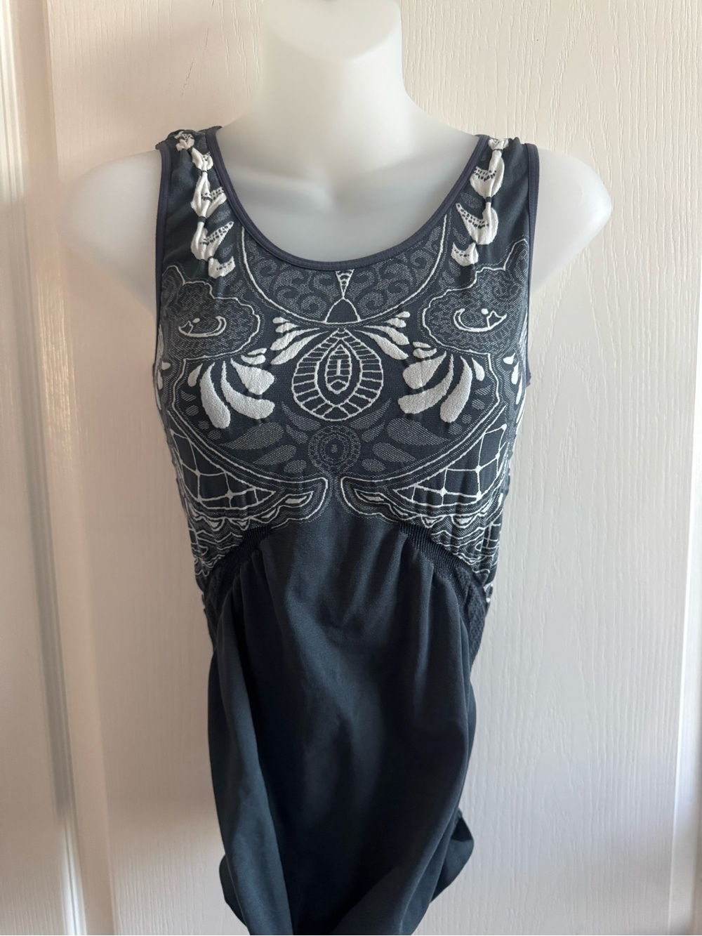 Athleta charcoal tank with beautiful white design